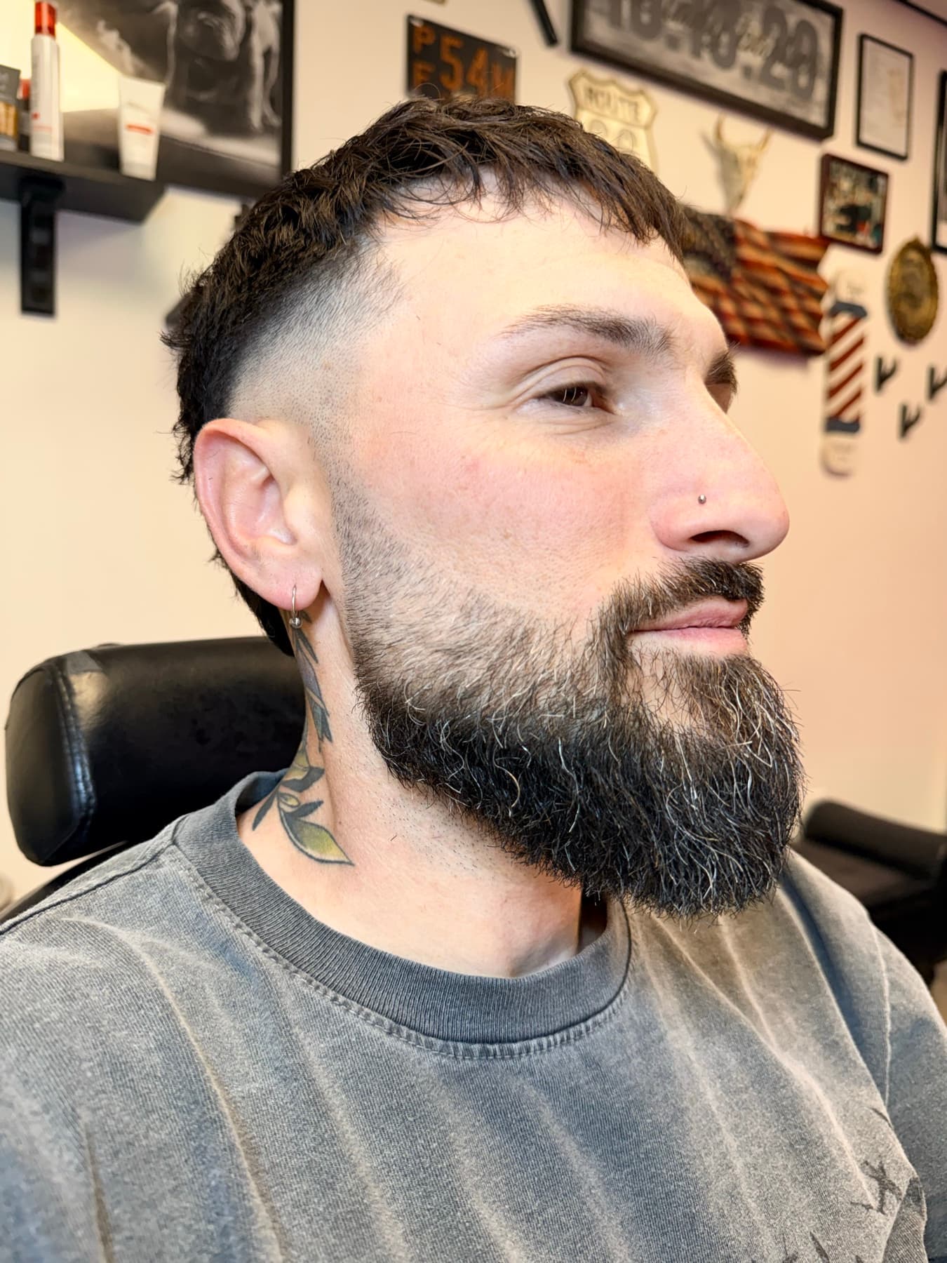 Textured crop with a burst fade and full beard